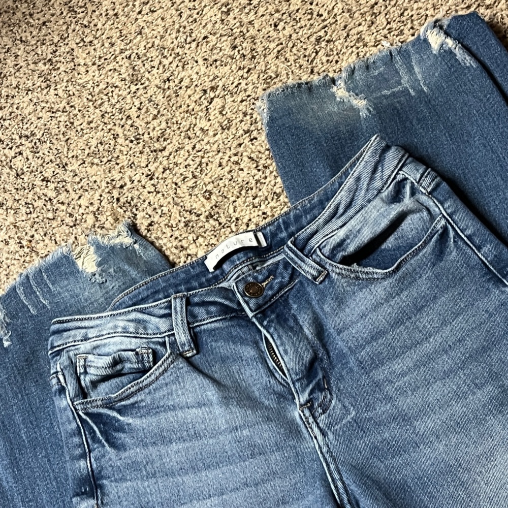Adorable ladies jeans with frayed hems.